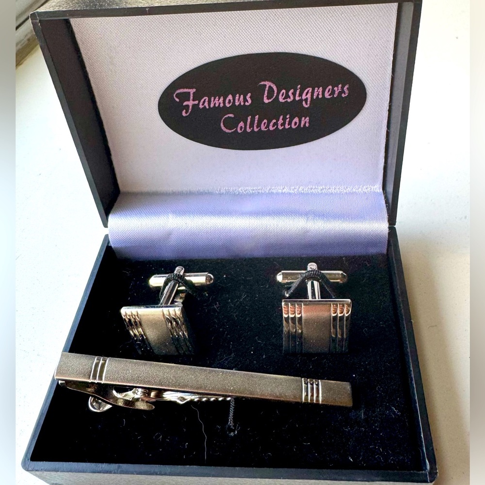 Cuff links and pin set. Used once, like new condition. Silver tone.
